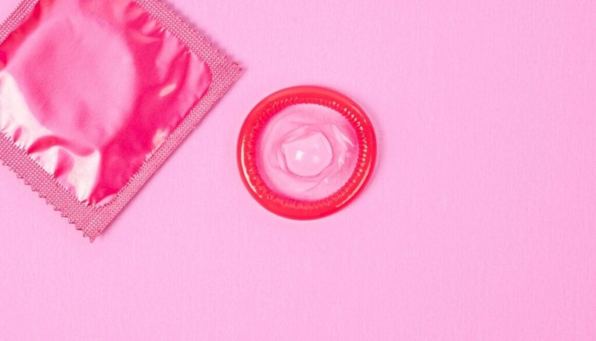 A picture of pink condom placed on the pink table