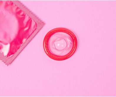 A picture of pink condom placed on the pink table