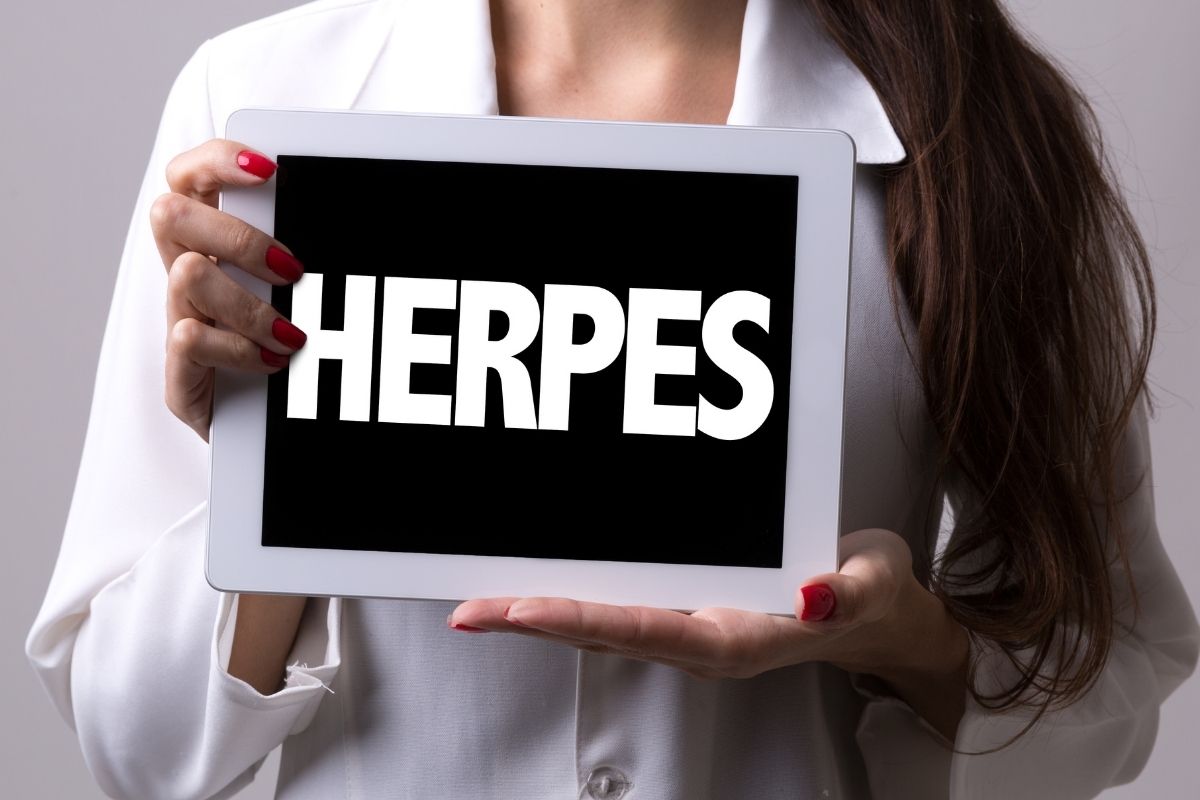 Young lady holding a herpes board concepts